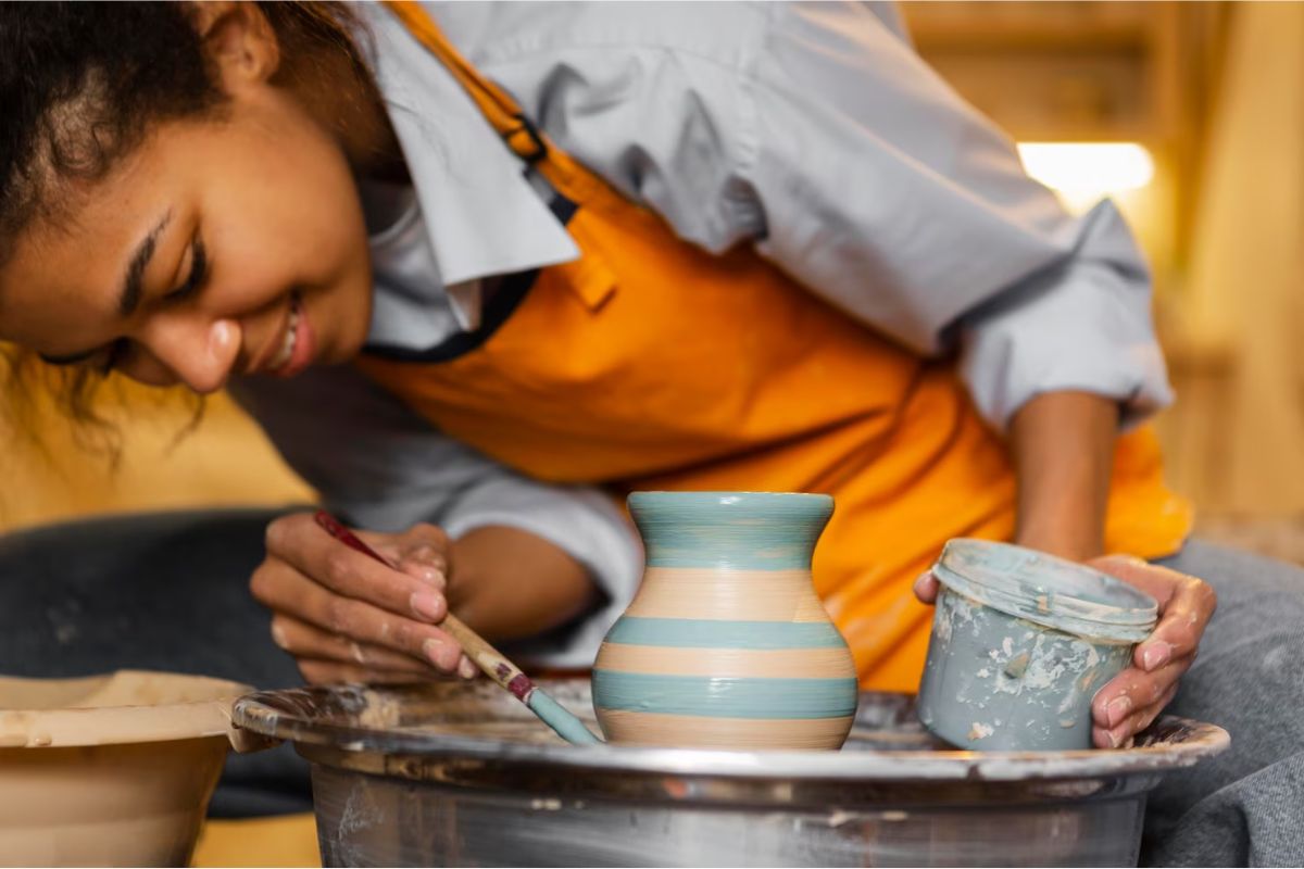 A girl engaging in a pottery class.