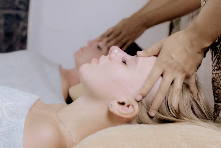 Two women getting face massage at Jaens Spa Center.