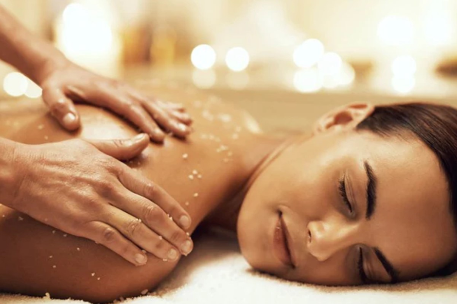 A woman enjoying body scrubs in Six Sense Uluwatu.