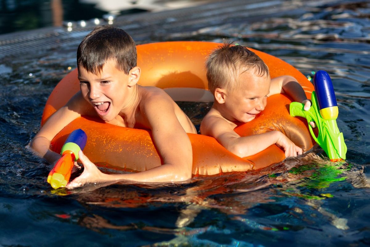 Kids playing in a pool.